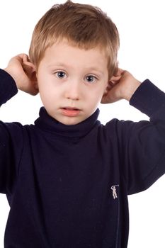 Cheerful kid grimaces, pulls his ears
