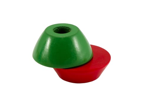 Green and red color wooden toy bricks with hole in center.