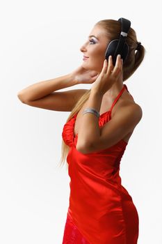 Portrait of young woman with headphones in studio