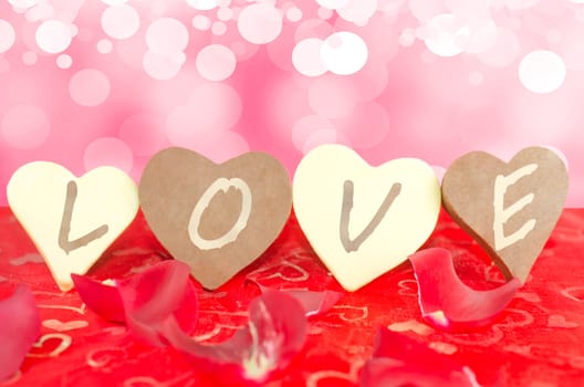 Valentine's composite image of four chocolates lined up with a LOVE message written in them.