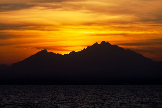 Romantic View of a Sunset over a Mountains