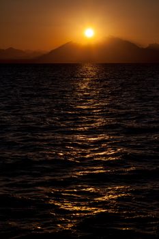 Romantic View of a Sunset over a Mountains