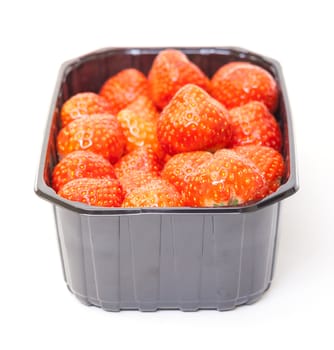 Fresh Strawberries in a Plastic Container on a white background.