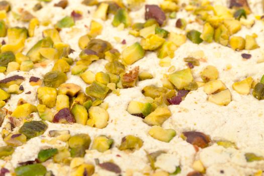 Halva with pistachios, background closeup