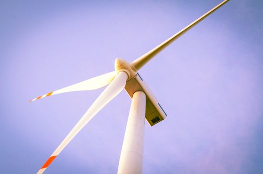 An image of windturbine of suny day