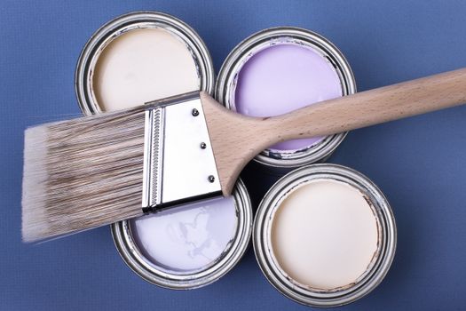 Latex brush and paint with blue background