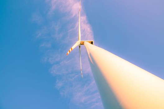 An image of windturbines at dusk