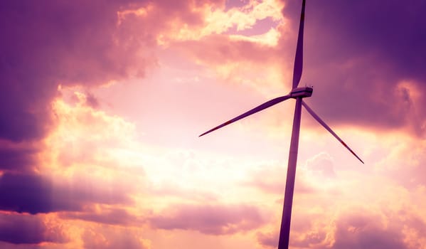 An image of windturbines at dusk