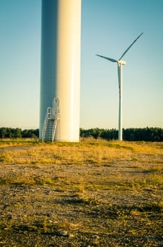 An image of windturbines at dusk