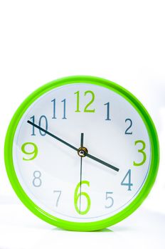 An image of green watch on white background