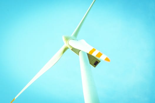 An image of windturbine of suny day