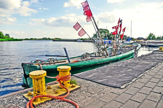 An image of boat docked at the wharf