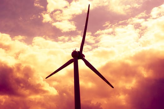 An image of windturbines at dusk