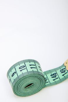 An image of green centimeter on white background