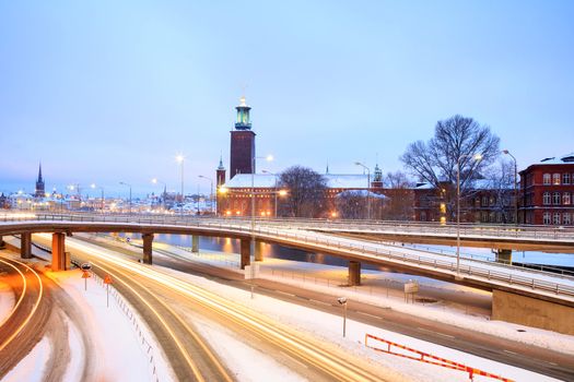 Stockholm Cityhall at dusk with transportation light trail Sweden