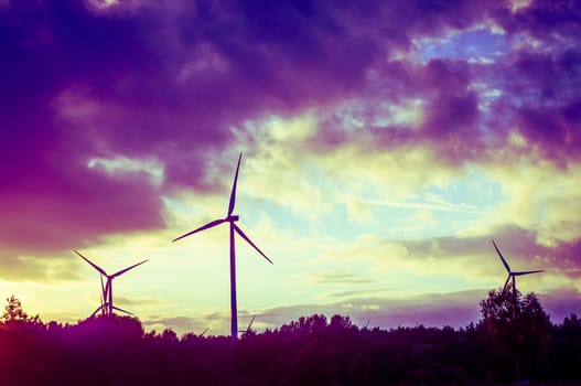 An image of windturbine during beautiful sunset