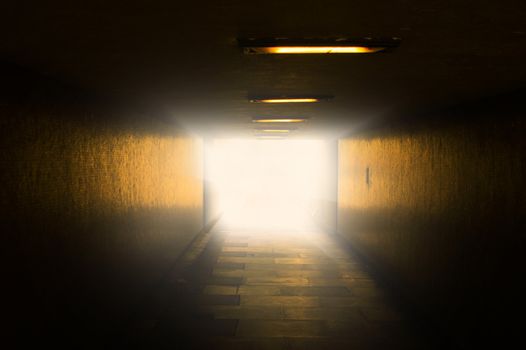 An image of bright light at the end of tunnel
