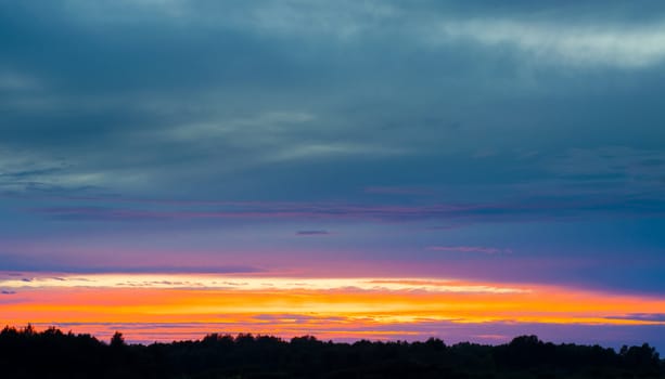 An image of amazing sunset over the forest