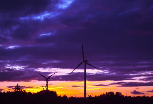 An image of windturbine during beautiful sunset