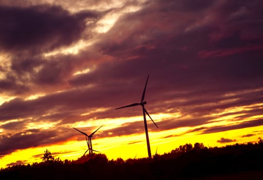An image of windturbine during beautiful sunset