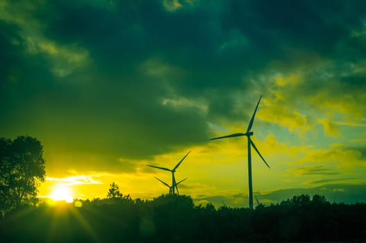 An image of windturbine during beautiful sunset