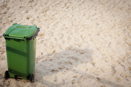 green waste bin on the beach
