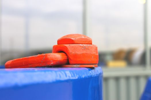 shackle with a bolt to the metal structure