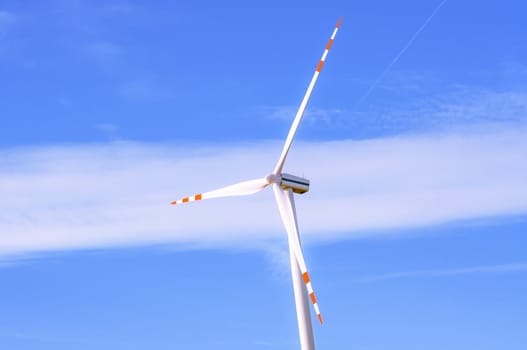 An image of windturbine of suny day