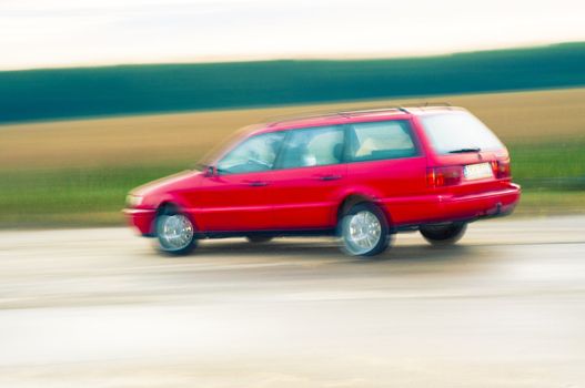 An abstract image of drunk driver driving red car
