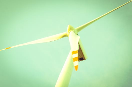 An image of windturbine of suny day