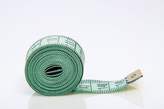 An image of green centimeter on white background
