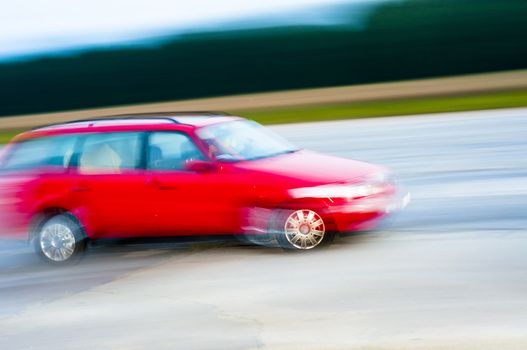 An abstract image of drunk driver driving red car