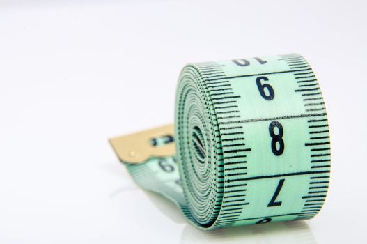 An image of green centimeter on white background