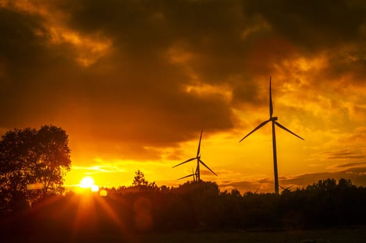 An image of windturbine during beautiful sunset