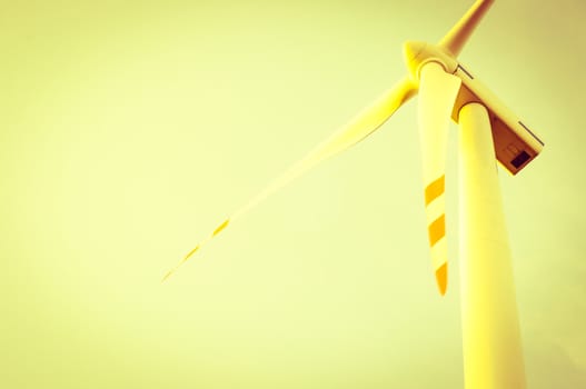 An image of windturbine of suny day