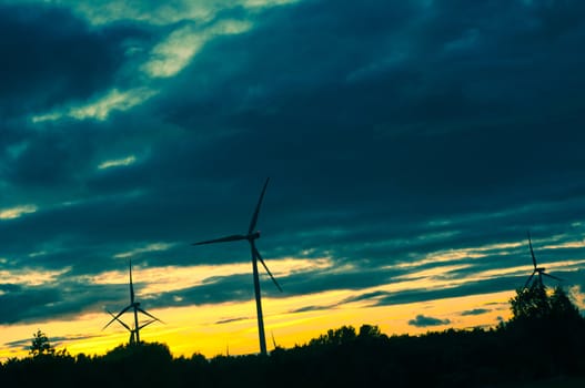 An image of windturbine during beautiful sunset