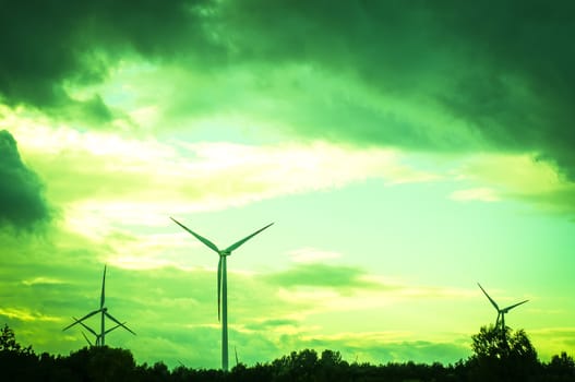 An image of windturbine during beautiful sunset