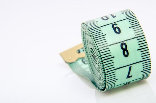 An image of green centimeter on white background