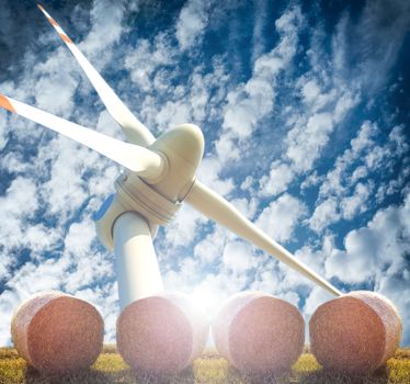 An image of three renewable energy. Wind, straw and sun