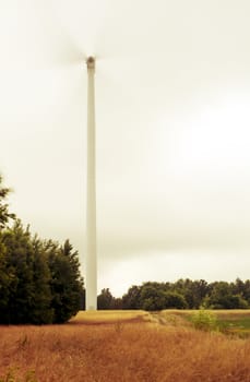 An image of windturbine of suny day