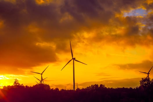 An image of windturbine during beautiful sunset