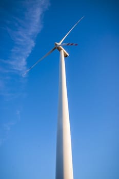 An image of windturbines at dusk