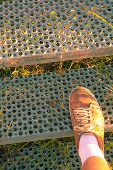 Shoe on a steel stairs 