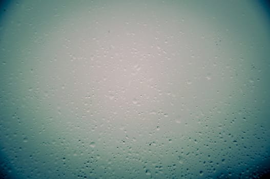 An image of waterdrops on the window