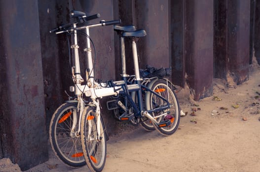 An image of two bikes near the steel fence