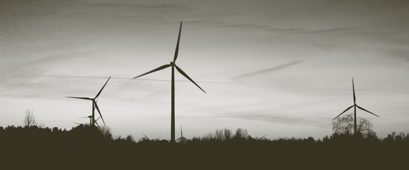 An image of windturbine of suny day