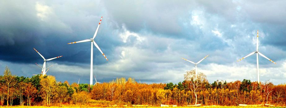 An image of windturbine of suny day