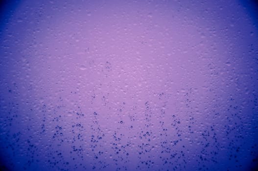 An image of waterdrops on the window