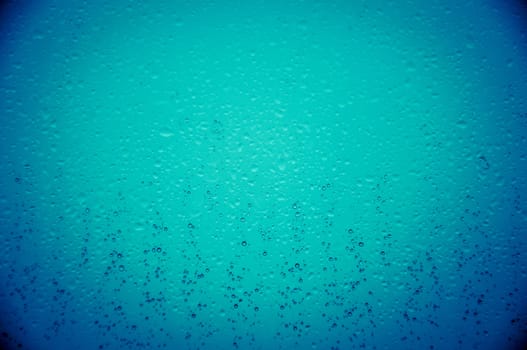 An image of waterdrops on the window