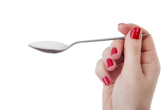An image of woman holding spoon full of sugar